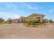 A welcoming clubhouse entrance with attractive landscaping and covered parking at 723 Orange Plume Walk # 0, Henderson, NV 89011