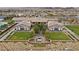 An aerial view showcases the community clubhouse with manicured lawns and an outdoor seating area at 723 Orange Plume Walk # 0, Henderson, NV 89011