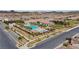 Aerial shot of a community pool area featuring ample seating, cabanas, and meticulously maintained landscaping at 723 Orange Plume Walk # 0, Henderson, NV 89011