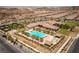 Aerial view of the community pool and spa, set within desert landscaping near neighborhood homes at 723 Orange Plume Walk # 0, Henderson, NV 89011