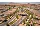 Aerial view of a guarded entrance to a well manicured community at 723 Orange Plume Walk # 0, Henderson, NV 89011