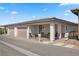 Home featuring a covered patio, a two-car garage, and a cozy outdoor seating area for relaxation and enjoyment at 723 Orange Plume Walk # 0, Henderson, NV 89011