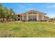 Impressive exterior of community clubhouse with manicured lawn, ideal for social events and gatherings at 723 Orange Plume Walk # 0, Henderson, NV 89011