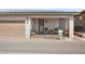 Another exterior view of the home, highlighting the covered porch and attached garage at 723 Orange Plume Walk # 0, Henderson, NV 89011