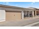 View of home featuring a 2-car garage and charming front porch with seating area at 723 Orange Plume Walk # 0, Henderson, NV 89011