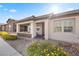 Inviting front exterior featuring a covered porch, well-manicured landscaping, and a charming walkway leading to the entrance at 723 Orange Plume Walk # 0, Henderson, NV 89011