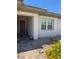 Inviting front entrance featuring a covered porch and a well-maintained landscape with decorative plants at 723 Orange Plume Walk # 0, Henderson, NV 89011