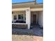 Charming front porch with brick accents and a cozy seating area to enjoy the outdoors at 723 Orange Plume Walk # 0, Henderson, NV 89011