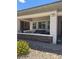 Inviting front porch features a seating area and stylish brick accents at 723 Orange Plume Walk # 0, Henderson, NV 89011
