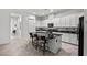 Kitchen featuring granite countertops, a large center island, and stainless steel appliances at 723 Orange Plume Walk # 0, Henderson, NV 89011