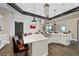 Community kitchen boasts a large island, a range, barstool seating, and modern appliances for communal cooking at 723 Orange Plume Walk # 0, Henderson, NV 89011
