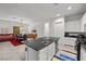 Kitchen island with granite countertops and stainless steel appliances overlooking the dining area at 723 Orange Plume Walk # 0, Henderson, NV 89011