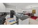Open concept kitchen with granite counters, stainless appliances and a view of the living space at 723 Orange Plume Walk # 0, Henderson, NV 89011