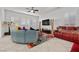 Bright living room with large sectional sofa, plantation shutters and modern decor at 723 Orange Plume Walk # 0, Henderson, NV 89011