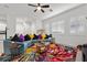 Inviting living room showcasing colorful decor, plantation shutters, and tile floors at 723 Orange Plume Walk # 0, Henderson, NV 89011