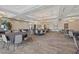 Large meeting room with round tables, modern lighting fixtures, and neutral color palette at 723 Orange Plume Walk # 0, Henderson, NV 89011