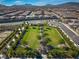 Scenic aerial view of a park with expansive green space and mature trees for recreational activities at 723 Orange Plume Walk # 0, Henderson, NV 89011