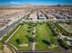 Picture-perfect park featuring well maintained landscaping, mature trees, and walkways at 723 Orange Plume Walk # 0, Henderson, NV 89011