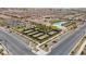 Community recreation area showcasing tennis courts, pool, clubhouse, and meticulous landscaping at 723 Orange Plume Walk # 0, Henderson, NV 89011