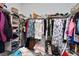 Walk-in closet with double rods and shelving full of various items at 723 Orange Plume Walk # 0, Henderson, NV 89011