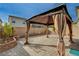 Brick paved backyard with gazebo and landscaping at 7675 W Mistral Ave, Las Vegas, NV 89113