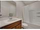 Clean bathroom with a tub and wood vanity at 7675 W Mistral Ave, Las Vegas, NV 89113
