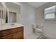 Clean bathroom with toilet, sink, and shower at 7675 W Mistral Ave, Las Vegas, NV 89113