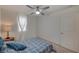 Well-lit bedroom featuring a ceiling fan and ample space at 7675 W Mistral Ave, Las Vegas, NV 89113