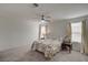 Spacious bedroom with a queen bed and ceiling fan at 7675 W Mistral Ave, Las Vegas, NV 89113