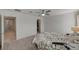 Spacious bedroom with ceiling fan and ensuite bathroom access at 7675 W Mistral Ave, Las Vegas, NV 89113