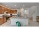 Modern kitchen with a large island, granite countertops, and stainless steel appliances at 7675 W Mistral Ave, Las Vegas, NV 89113