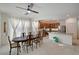 Bright kitchen features an island, hardwood floors, and a dining area at 7675 W Mistral Ave, Las Vegas, NV 89113