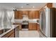 Modern kitchen with stainless steel appliances and granite countertops at 7675 W Mistral Ave, Las Vegas, NV 89113