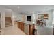 Open kitchen with island, stainless steel appliances, and granite countertops at 7675 W Mistral Ave, Las Vegas, NV 89113