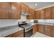 Modern kitchen with stainless steel appliances and granite countertops at 7675 W Mistral Ave, Las Vegas, NV 89113