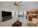 Open concept living room with kitchen and dining area visible at 7675 W Mistral Ave, Las Vegas, NV 89113