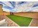 Artificial turf backyard with a trampoline at 8136 Little Skye Ct, Las Vegas, NV 89166