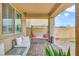 Relaxing backyard patio with seating and a swing at 8136 Little Skye Ct, Las Vegas, NV 89166
