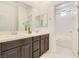 Double vanity bathroom with a large mirror and separate shower/tub at 8136 Little Skye Ct, Las Vegas, NV 89166