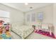 Bedroom with white furniture, playful rug and window coverings at 8136 Little Skye Ct, Las Vegas, NV 89166