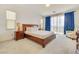 Spacious bedroom with wood furniture and sliding glass doors at 8136 Little Skye Ct, Las Vegas, NV 89166