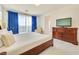 Primary bedroom with large bed, dresser, and ensuite access at 8136 Little Skye Ct, Las Vegas, NV 89166