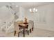 Elegant dining room with wood table and six chairs at 8136 Little Skye Ct, Las Vegas, NV 89166