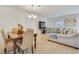 Dining area with wood table, chairs, and view into living room at 8136 Little Skye Ct, Las Vegas, NV 89166