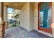 Front entry with a modern wood door and stone accents at 8136 Little Skye Ct, Las Vegas, NV 89166