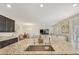 Kitchen features a large island with sink and breakfast bar at 8136 Little Skye Ct, Las Vegas, NV 89166