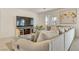 Spacious living room with sectional sofa and large TV at 8136 Little Skye Ct, Las Vegas, NV 89166