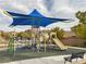 Modern playground with shade structure and slide at 8136 Little Skye Ct, Las Vegas, NV 89166