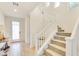 Modern staircase with white railings and carpeted steps at 8136 Little Skye Ct, Las Vegas, NV 89166