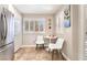 Bright breakfast nook with white shutters, a cozy table, and stainless steel refrigerator at 830 Cozette Ct # 102, Las Vegas, NV 89144